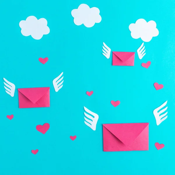 Three flying letters from paper, message, valentines day, hearts, blue background, wings, minimalism