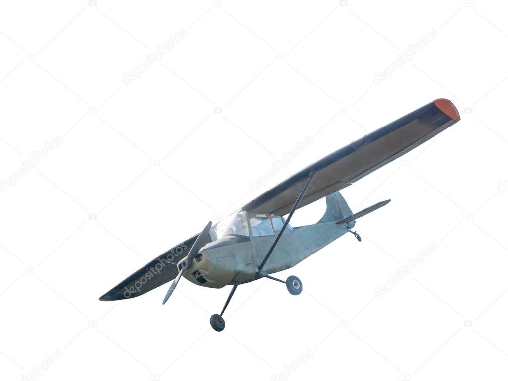 Front side view of  vintage airplane with piston engine and propeller. Isolated on white background with clipping path.