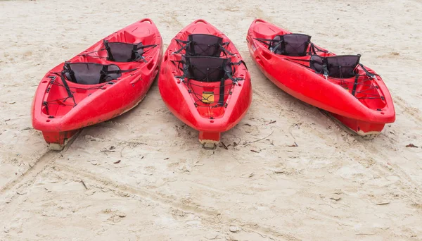 Kayak with paddle and life jacket Parked on beautiful beaches, popular sports and water recreation