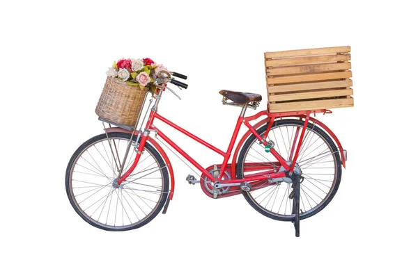 red classic bike with flower in basket and crate isolate on white background