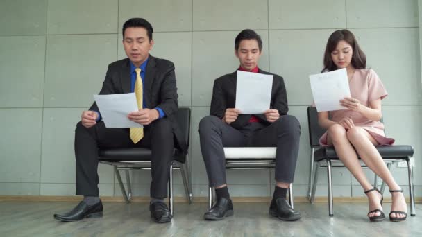Jobless Business People Applicants Group Sitting Chairs Queue Line Row — Stock Video