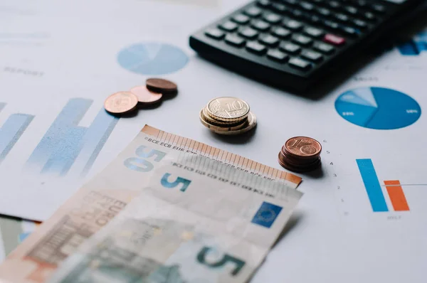 European union currency with calculator, business chart on desk. business concept, financial documentation, financial statements, financial statements