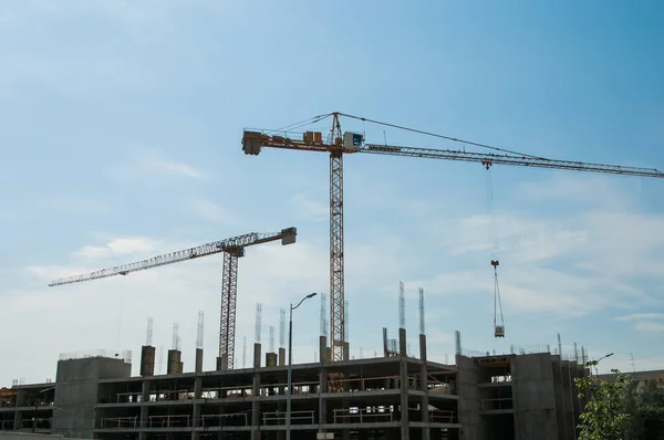 Steel Frames of A Building Under Construction, With Tower Crane On To