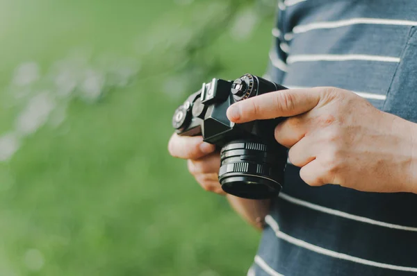 vintage old camera in hand