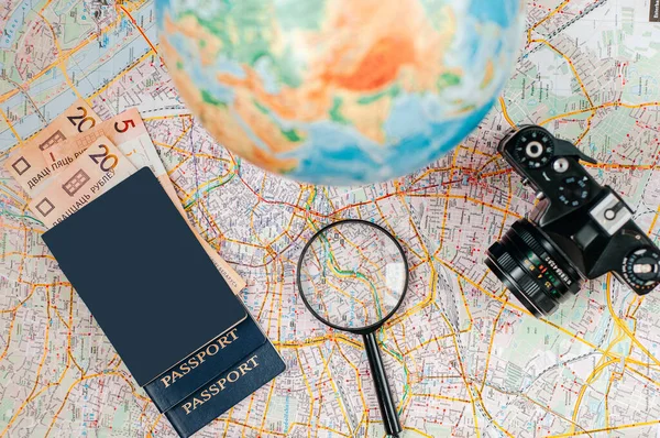 world map, passport and money, tourism and recreation concept