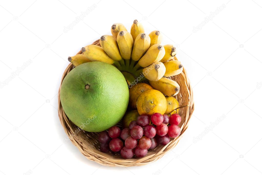 Mixed fruit basket of Pomelo grape Orange and banana. top view isolated on white background and clipping path.