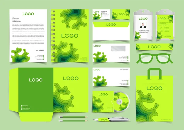 工作空间平铺文具在剪纸艺术风格与绿色和黄色的企业标识集 文具模板设计套件 品牌模板可编辑品牌标识包 — 图库矢量图片