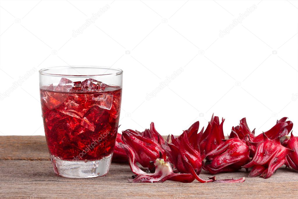 roselle mocktail drink with roselle fruits or Hibiscus sabdariffa on wooden isolated on white with clipping path .Jamaica sorrel .