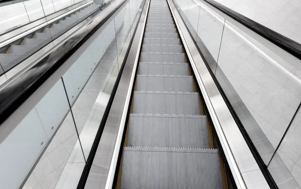 Shopping mall with moving escalators