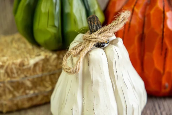 Close view of the white pumpkin with the blur view on the back with other colored pumpkins. — Zdjęcie stockowe
