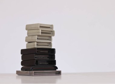 Pile of videogame cartridges of different systems over white background clipart