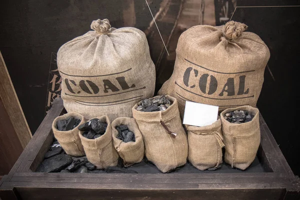 The Charcoal in little cotton sacks.