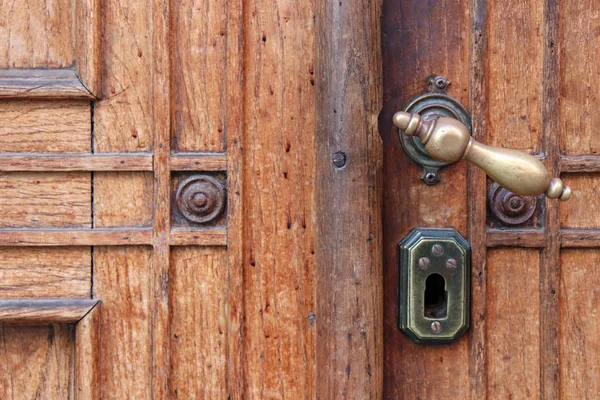 Modern wooden door with metal door handle over — Stock Photo, Image