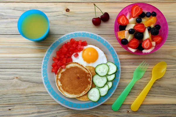 healthy breakfast pancake eggs and fruit salad