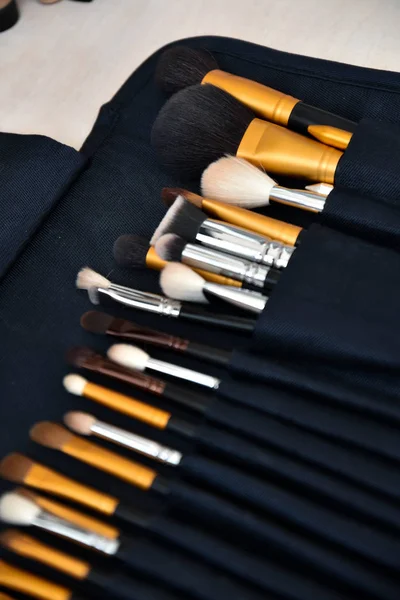 Professional make-up, brushes and accessories on the table. Equipment of facial make over art.