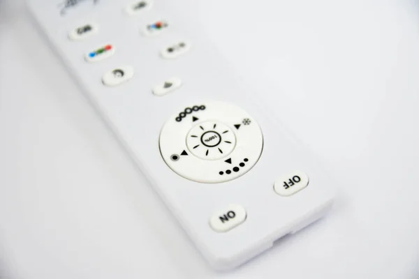 remote control over white background.
