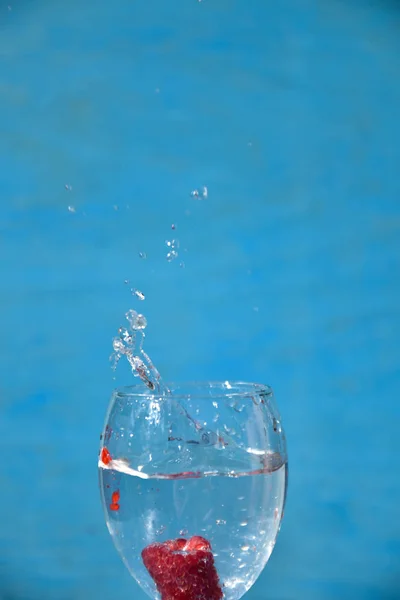 Raspberry in the water, art soft focus. Stock Photo