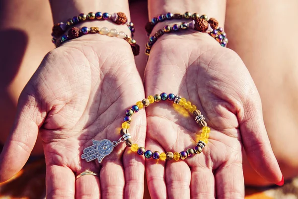 Female Palms Natural Bead Stone Bracelets Holding Bracelet Hamsa Pendant — Stock Photo, Image