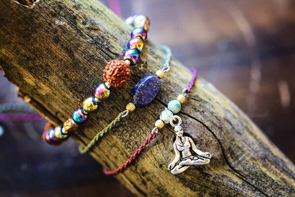 Natural gemstone beads bracelets on wooden background