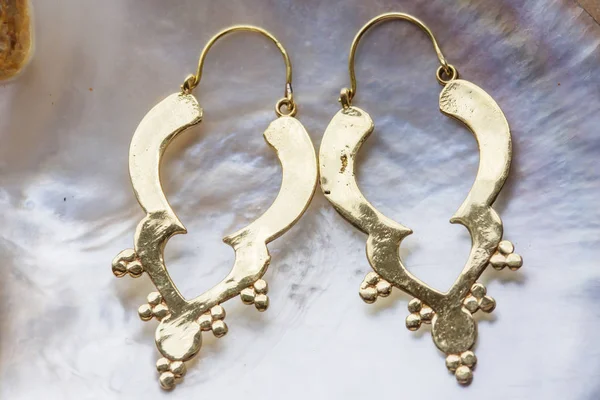 Boho Style Brass Big Decorative Earrings Pearl Background — Stock Photo, Image