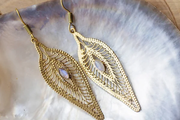 Boho Style Brass Big Decorative Earrings Pearl Background — Stock Photo, Image