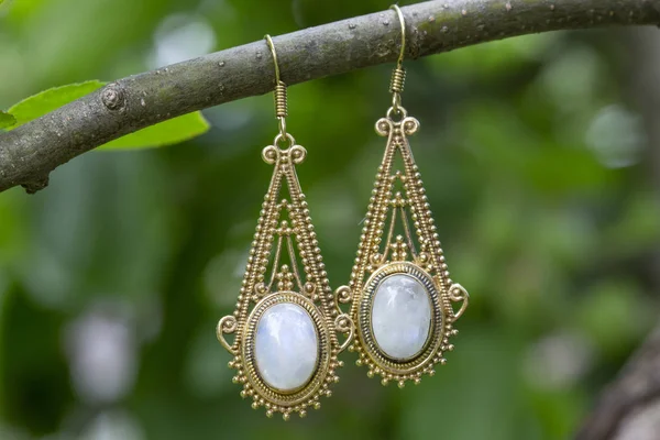 Brass Metal Earrings Natural Mineral Moon Stone Hanging Tree Branch — Stock Photo, Image