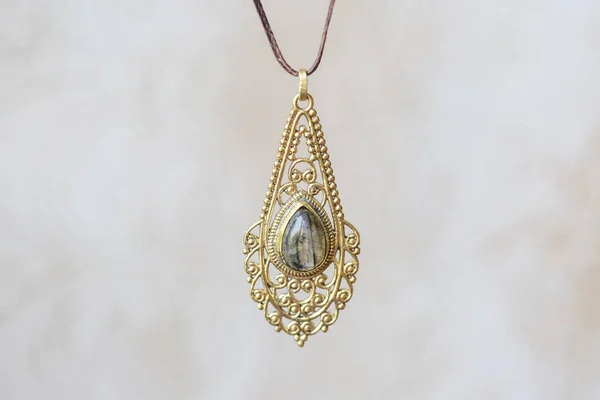 Brass Metal Labradorite Stone Pendant Mandala Neutral Background — Stock Photo, Image