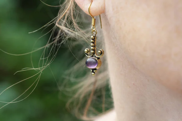 Woman Wearing Brass Metal Earring Amethyst Mineral Gemstone — Stock Photo, Image