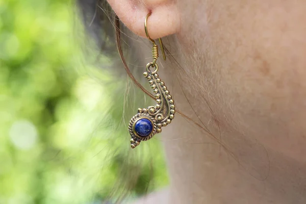 Woman Wearing Brass Metal Earring Lapis Lazuli Mineral Gemstone — Stock Photo, Image