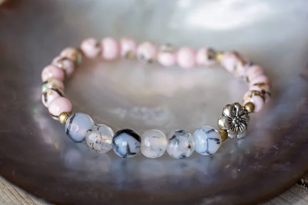 Natural mineral stone bracelet on wooden background