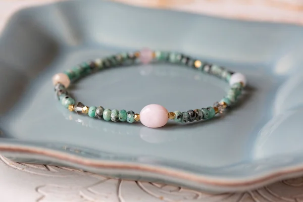 Mineral stone bracelet on white decorative background