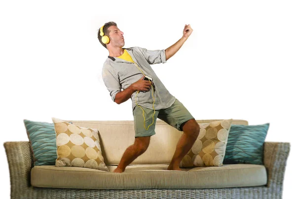 Young Happy Excited Man Jumping Sofa Couch Listening Music Mobile — Stock Photo, Image