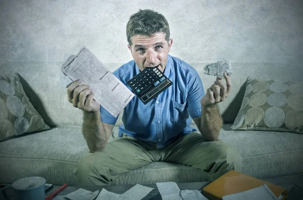 Young Stressed Overwhelmed Man Biting Calculator Holding Mess Bank Receipts — Stock Photo, Image