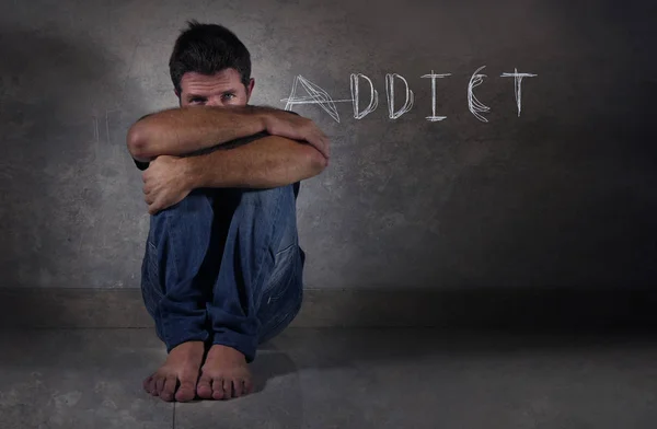 Young Depressed Addict Man Sitting Isolated Floor Shady Dramatic Studio — Stock Photo, Image
