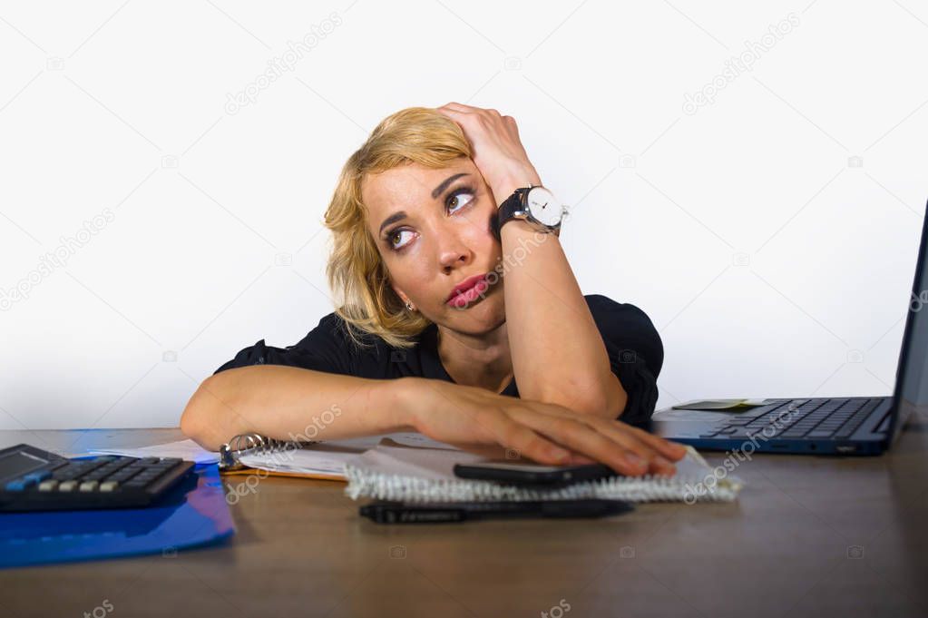 office portrait of young sad and depressed business woman working lazy at laptop computer desk feeling bored and tired looking thoughtful and pensive in work routine and job problem 