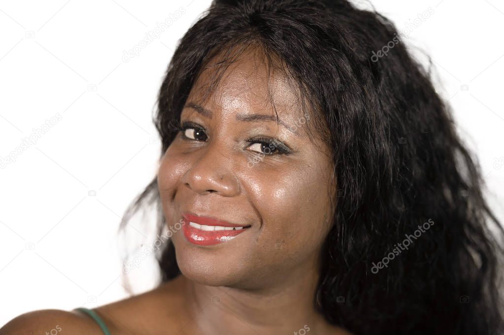 isolated close up portrait of young happy and beautiful black African American woman posing carefree feeling positive looking at the camera smiling cheerful and having fun