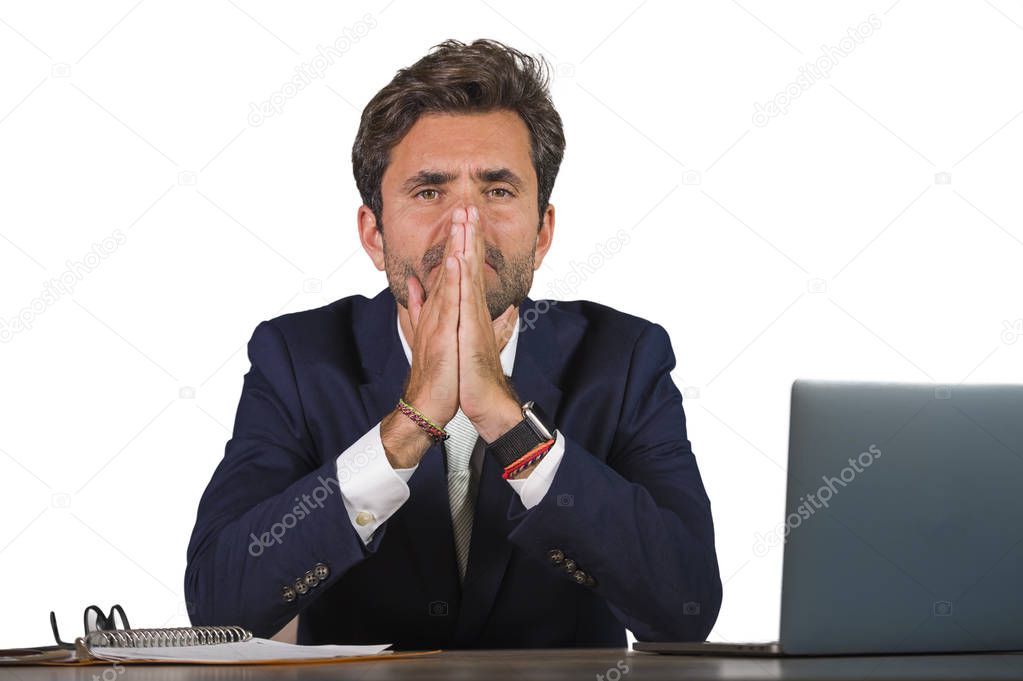 young sad and depressed business man working overwhelmed and frustrated on laptop computer office desk feeling upset and stressed suffering depression problem and anxiety crisis