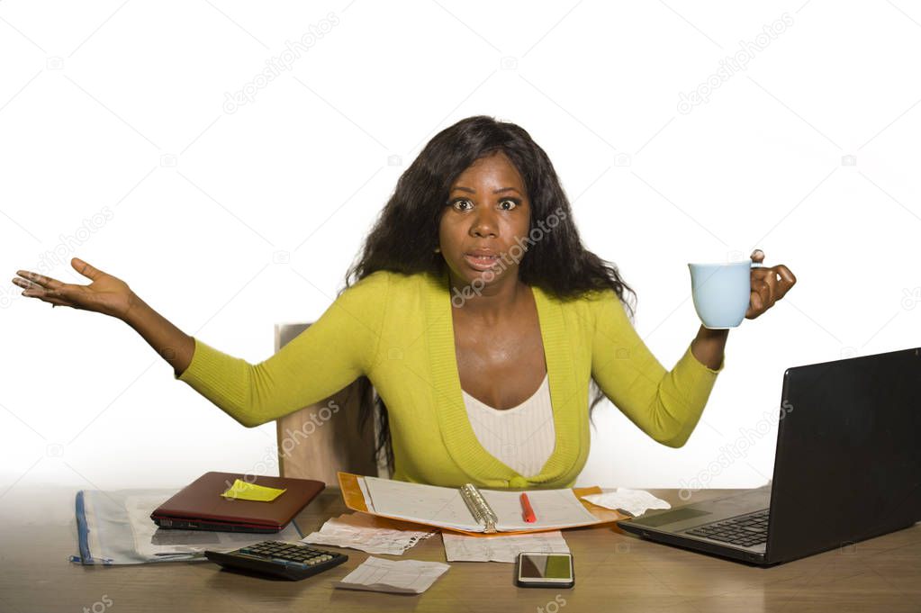 young attractive stressed and overworked black African American woman working upset and desperate at office computer desk feeling overwhelmed suffering business stress problem concept