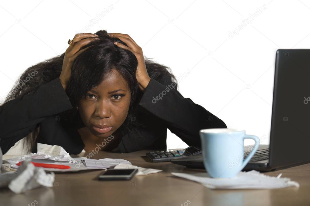 young angry and upset black African American business woman working in stress at office computer desk feeling desperate and exhausted looking burnt and pissed isolated on white background