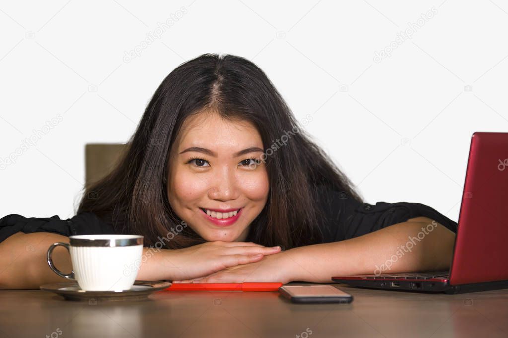young beautiful and happy Asian Korean business woman working relaxed at corporate company computer desk smiling cheerful  as successful investor or CEO in job lifestyle concept