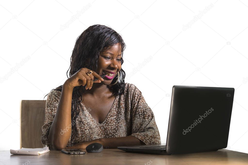 portrait of young beautiful and happy black afro American business woman working cheerful at office laptop computer desk isolated on white background in corporate company job success concept
