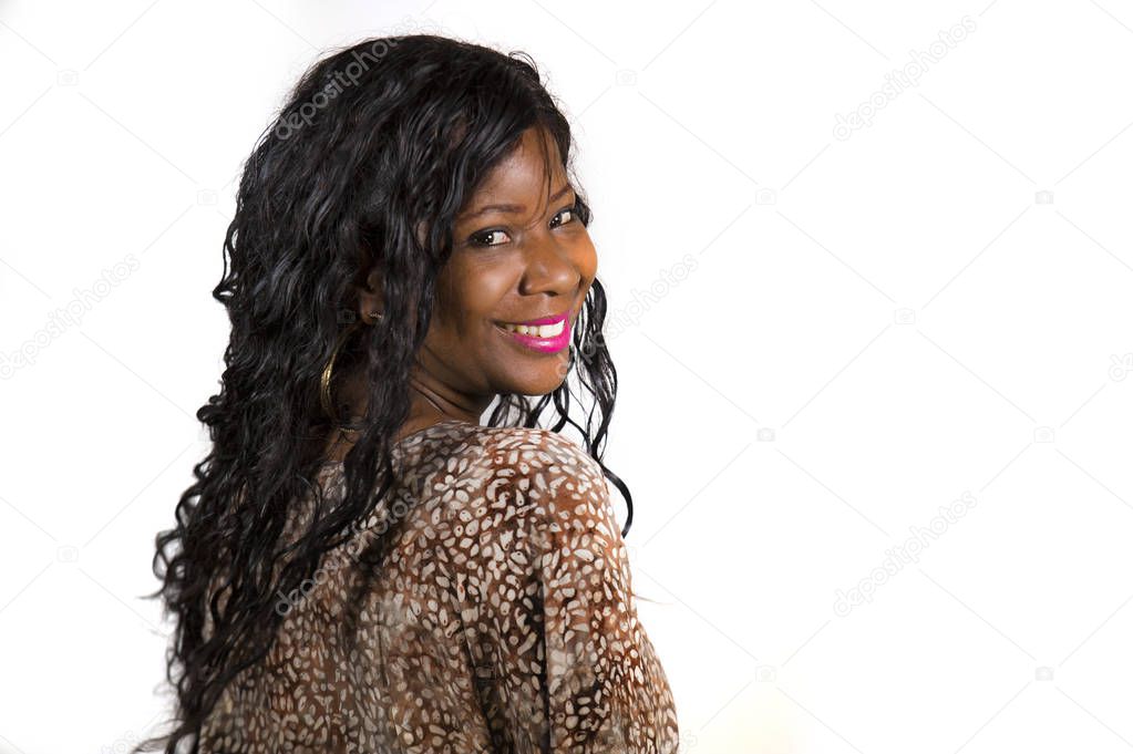 portrait of young beautiful and happy black afro American woman in cool exotic dress smiling cheerful and positive isolated on white background in beauty and fashion concept