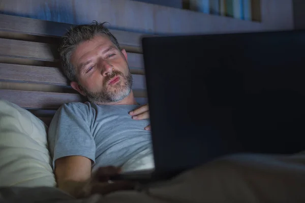 Young Aroused Man Alone Bed Playing Cybersex Using Laptop Computer — Stock Photo, Image