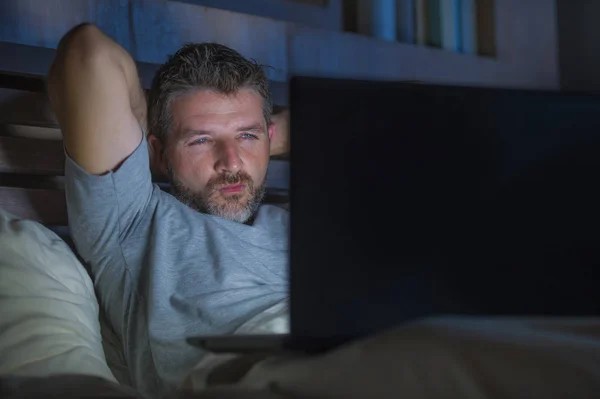 Young Aroused Man Alone Bed Playing Cybersex Using Laptop Computer — Stock Photo, Image