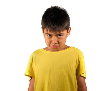 8 years old male child sad and ashamed after suffering reprimand isolated on white background wearing yellow t-shirt in emotional kid scolded and nagged face expression clipart