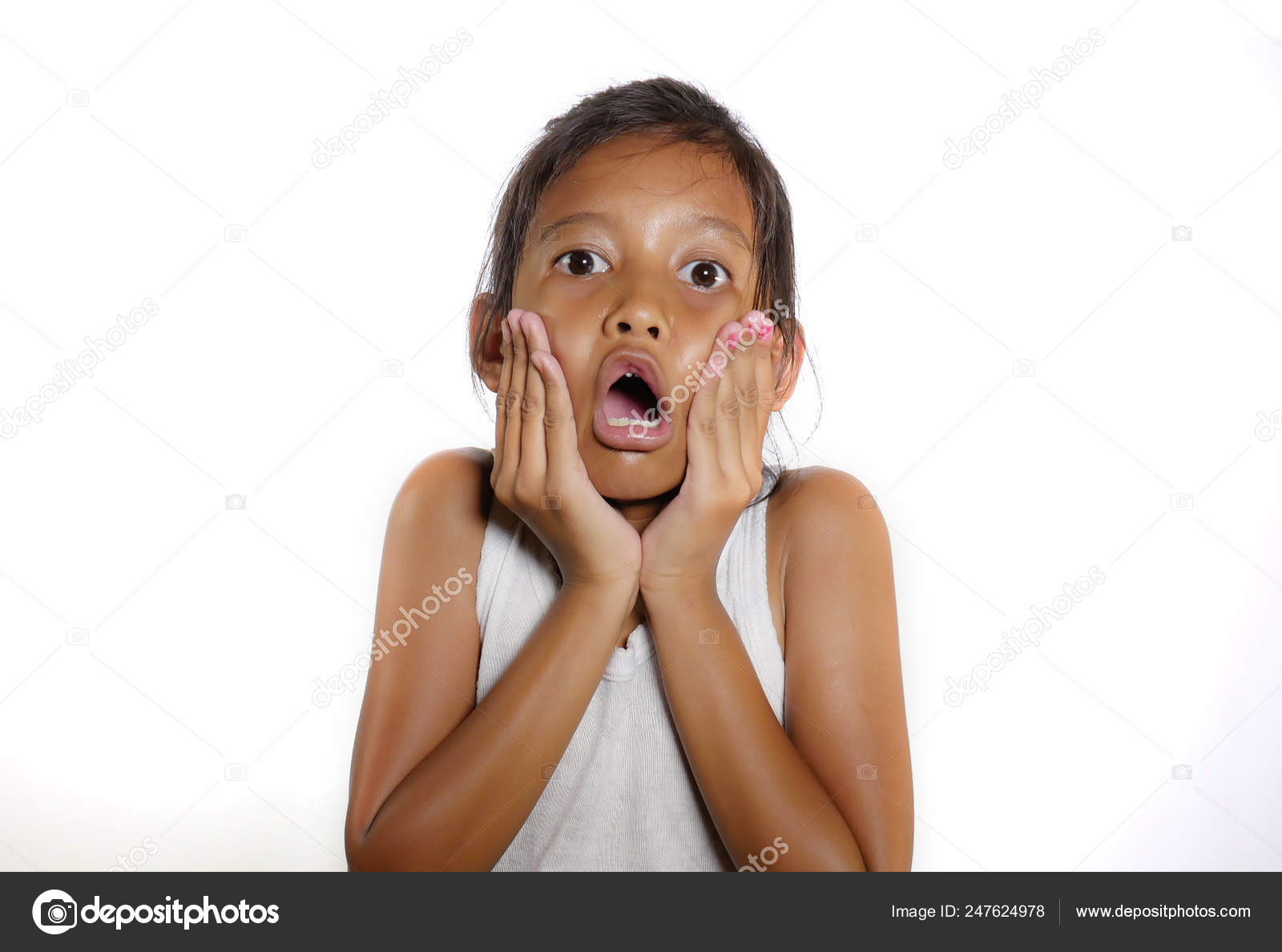 Sweet and cute 7 or 8 years old female child shocked and surprised opening  mouth in disbelief and surprise face expression isolated on white  background Stock Photo by ©TheVisualsYouNeed 247624978