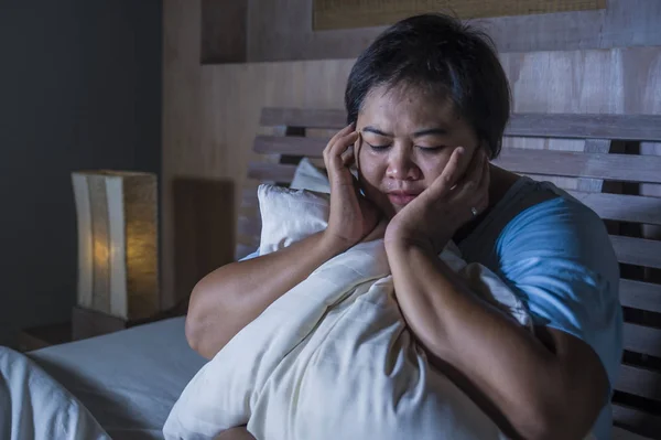 Young sad and depressed fat and chubby Asian girl feeling upset and desperate crying on bed at home victim of bullying and discrimination for her plus size and overweight — Stock Photo, Image