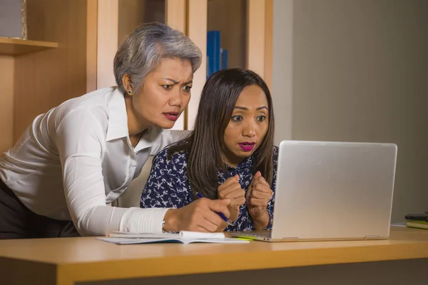 Upset business woman nagging and scolding on employee girl angry for computer mistake in office boss or chief authority and assistant suffering reprimand — Stock Photo, Image