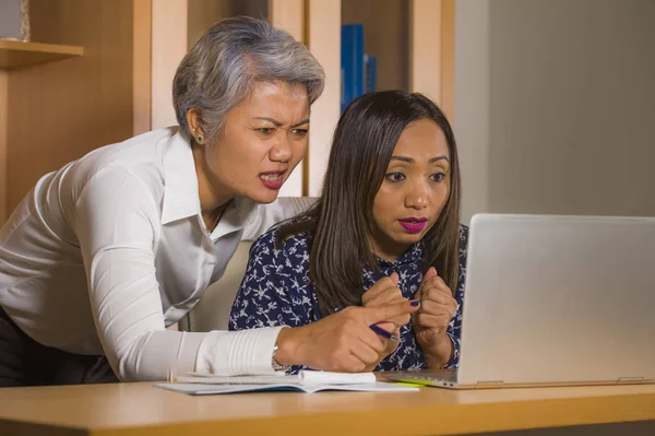 Upset business woman nagging and scolding on employee girl angry for computer mistake in office boss or chief authority and assistant suffering reprimand — Stock Photo, Image