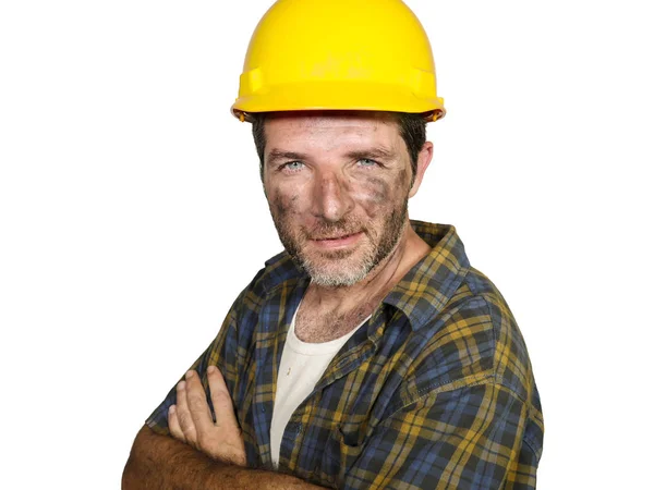 Corporate portrait of construction worker - attractive and happy builder man in safety helmet smiling confident as successful contractor or cheerful handyman Stock Photo